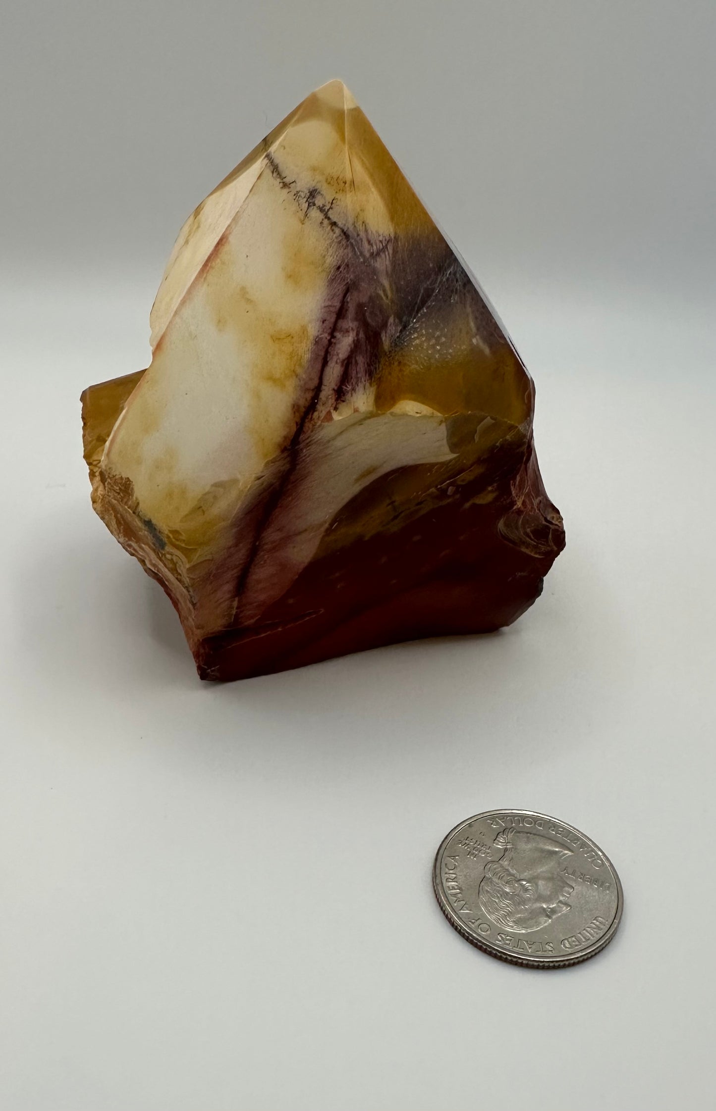 Mookaite point on raw base