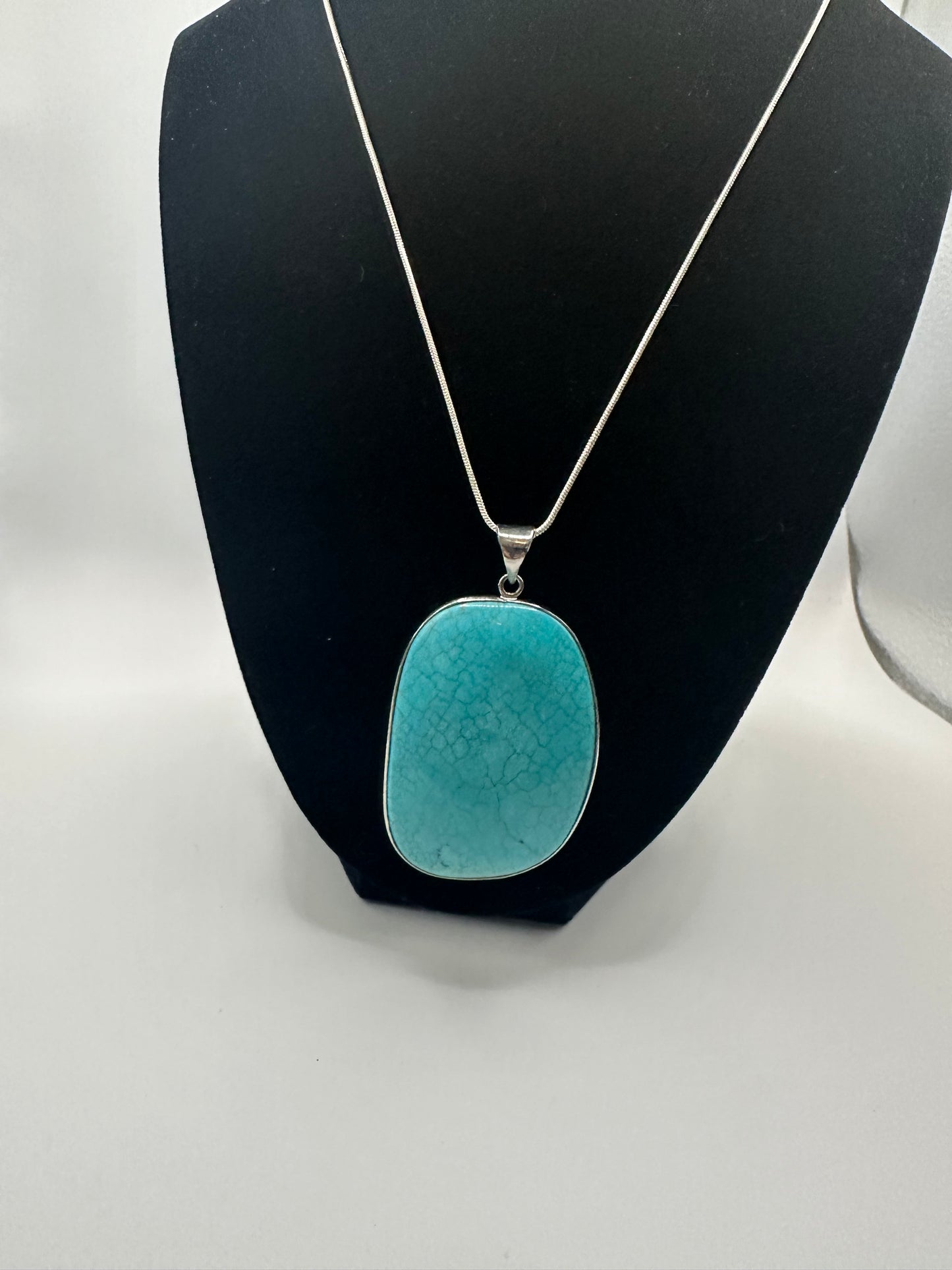 Turquoise pendant on sterling silver chain