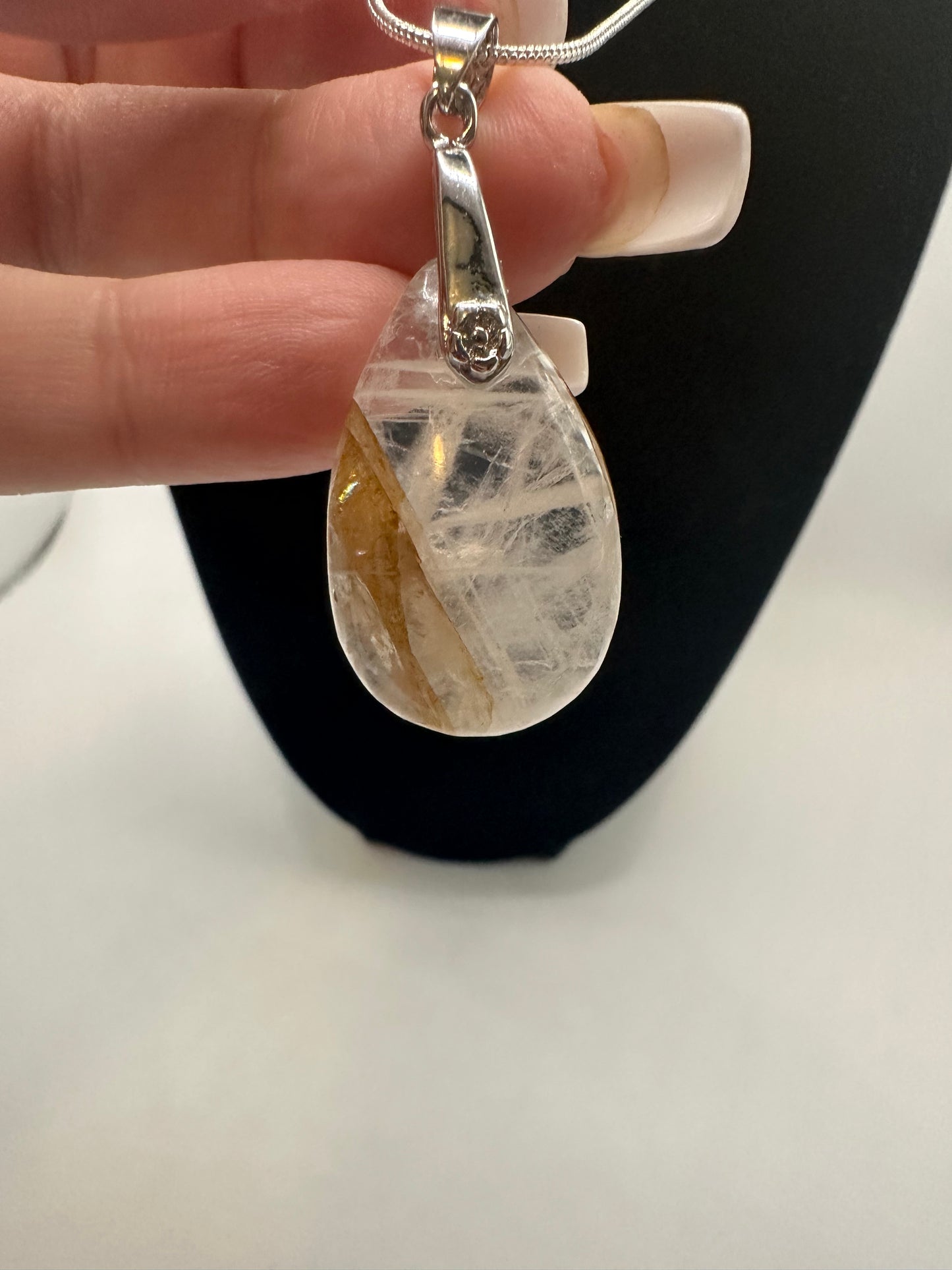 Clear quartz pendant with golden healer